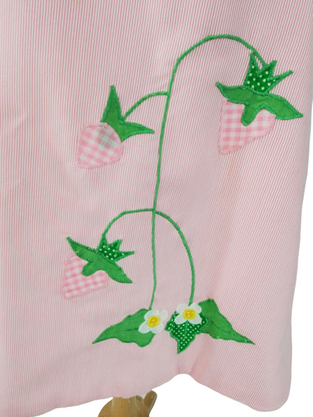 close view of gingham strawberry applique