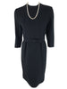 Close up view of vintage black wool wiggle dress