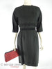 50s black Henry Lee cocktail dress at Better Dresses Vintage. Front view with belt.