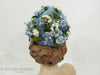 Vintage 50s or 60s whimsical blue floral hat at Better Dresses Vintage. Back view.