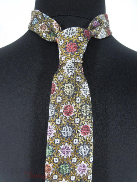 close view of metallic gold on black oriental design necktie