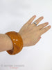 40s Butterscotch Wide Carved Bakelite Bangle - on an arm