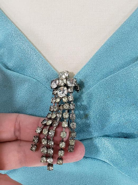 removable brooch on mini cocktail dress