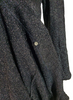 Spare button on interior seam at hem