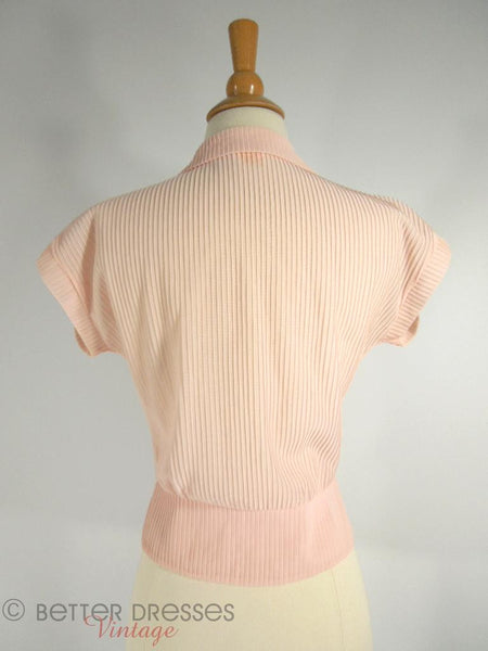 Chemisier péplum en nylon rose des années 50