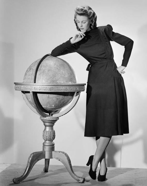 40s woman with globe