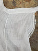 detail of white pin apron showing french seams