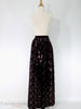 70s or 80s Oscar de la Renta deep plum velvet skirt with sequined paisleys at Better Dresses Vintage. Alternate view showing color from a distance.