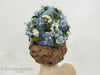 Vintage 50s or 60s whimsical blue floral hat at Better Dresses Vintage. Back view.