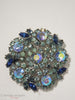 Crown Trifari 1961 Blue Green AB Brooch from Memo to a Smart Woman campaign, at Better Dresses Vintage - on white ground