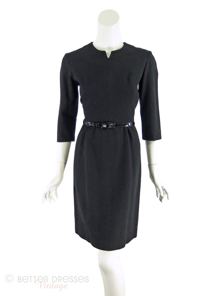 late 50s or early 60s black wiggle dress shown with belt