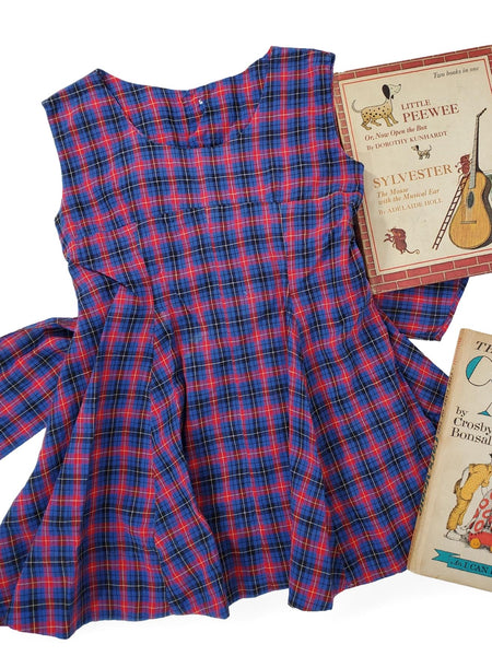 Front view of child's 50s full skirted plaid dress