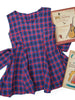 Front view of child's 50s full skirted plaid dress