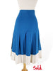 Near-identical skirt in blue with white, available at BDV.