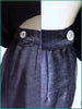 zipper and shell button on either side of skirt